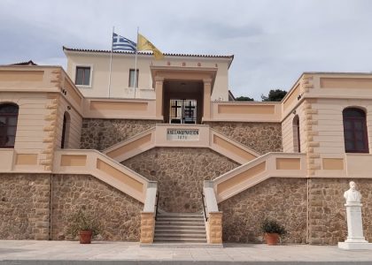 Explore this neoclassical architecture in Kalamata, Greece featuring stone and stucco design.